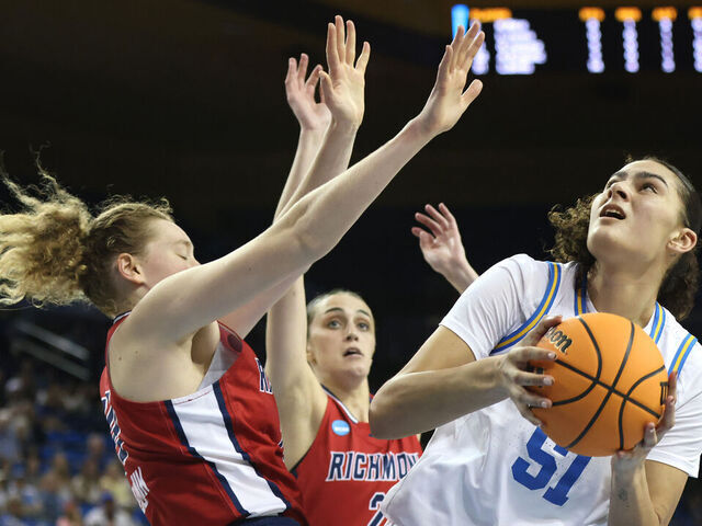 LOS ANGELES, CALIFORNIA - MARCH 23: Lauren Betts #51 of the UCLA Bruins shoots as Addie Budnik #20 of the Richmond Spiders defends in the second half during the second round of the NCAA Women's Basketball Tournament at UCLA Pauley Pavilion on March 23, 2025 in Los Angeles, California.