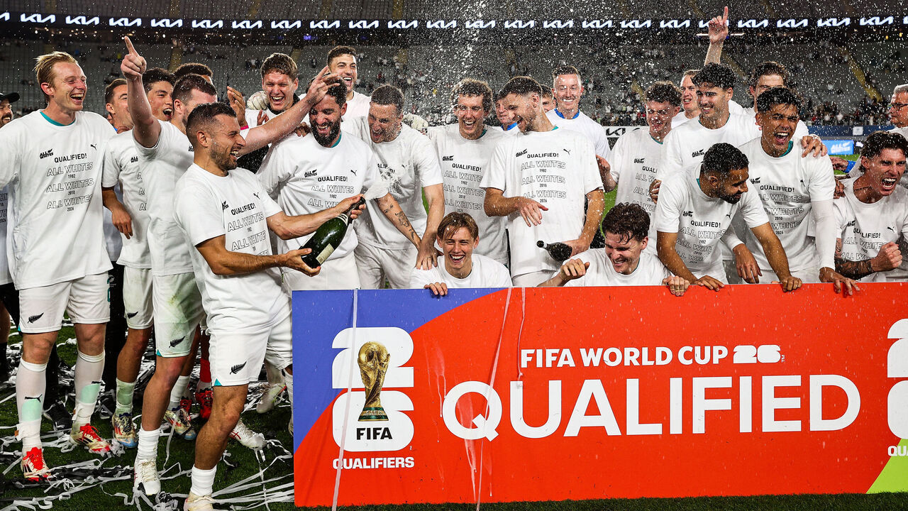 TOPSHOT - New Zealand's players celebrate after their victory during the FIFA World Cup 2026 Oceania qualifiers group final football match between New Zealand and New Caledonia at Eden Park Stadium in Auckland on March 24, 2025.