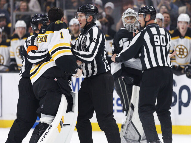 LOS ANGELES, CALIFORNIA - MARCH 23: Jeremy Swayman #1 of the Boston Bruins and Darcy Kuemper #35 of the Los Angeles Kings leave their crease and meet at center ice during the second period at Crypto.com Arena on March 23, 2025 in Los Angeles, California.