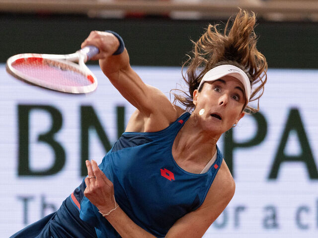 PARIS, FRANCE - MAY 28: Alize Cornet of France serves against Zheng Qinwen of People's Republic of China in the Women's Singles first round match on Day Three of the 2024 French Open at Roland Garros on May 28, 2024 in Paris, France