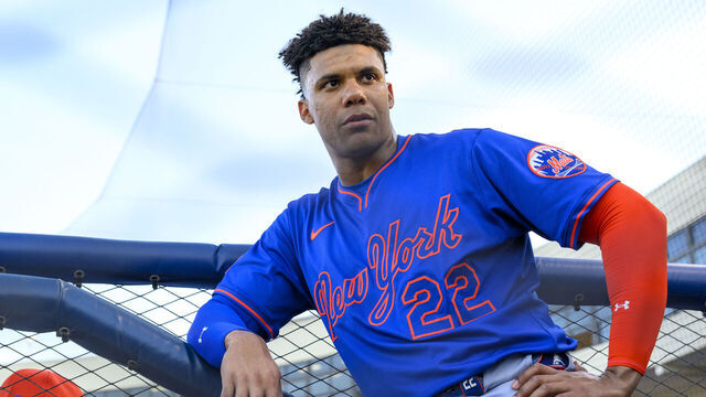 WEST PALM BEACH, FL - MARCH 20: New York Mets outfielder Juan Soto (22) leans against a railing in the dugout during an MLB spring training game between the New York Mets and the Washington Nationals at the CACTI Park of the Palm Beaches on March 20, 2025 in West Palm Beach, Florida.