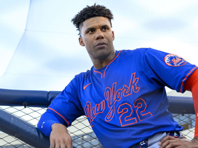 WEST PALM BEACH, FL - MARCH 20: New York Mets outfielder Juan Soto (22) leans against a railing in the dugout during an MLB spring training game between the New York Mets and the Washington Nationals at the CACTI Park of the Palm Beaches on March 20, 2025 in West Palm Beach, Florida.