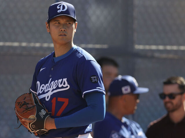 GLENDALE, ARIZONA - FEBRUARY 22: Shohei Ohtani #17 of the Los Angeles Dodgers prepares to throw a pitch before a spring training game against the Kansas City Royals at Camelback Ranch on February 22, 2025 in Glendale, Arizona.