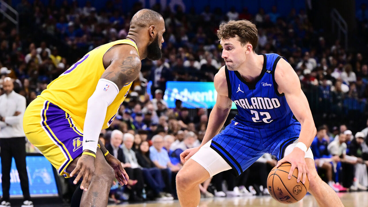 ORLANDO, FLORIDA - MARCH 24: Franz Wagner #22 of the Orlando Magic dribbles the ball to the basket against LeBron James #23 of the Los Angeles Lakers in the second half of a game at Kia Center on March 24, 2025 in Orlando, Florida.