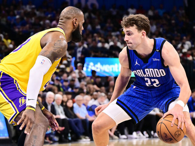ORLANDO, FLORIDA - MARCH 24: Franz Wagner #22 of the Orlando Magic dribbles the ball to the basket against LeBron James #23 of the Los Angeles Lakers in the second half of a game at Kia Center on March 24, 2025 in Orlando, Florida.