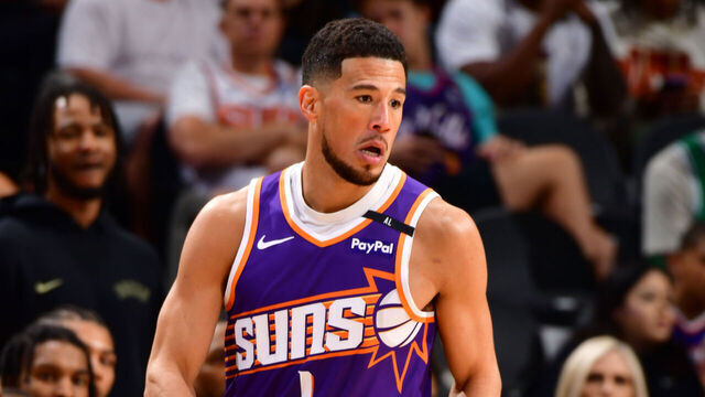 PHOENIX, AZ - MARCH 24: Devin Booker #1 of the Phoenix Suns dribbles the ball during the game against the Milwaukee Bucks on March 24, 2025 at PHX Arena in Phoenix, Arizona. Mandatory Copyright Notice: Copyright 2025 NBAE