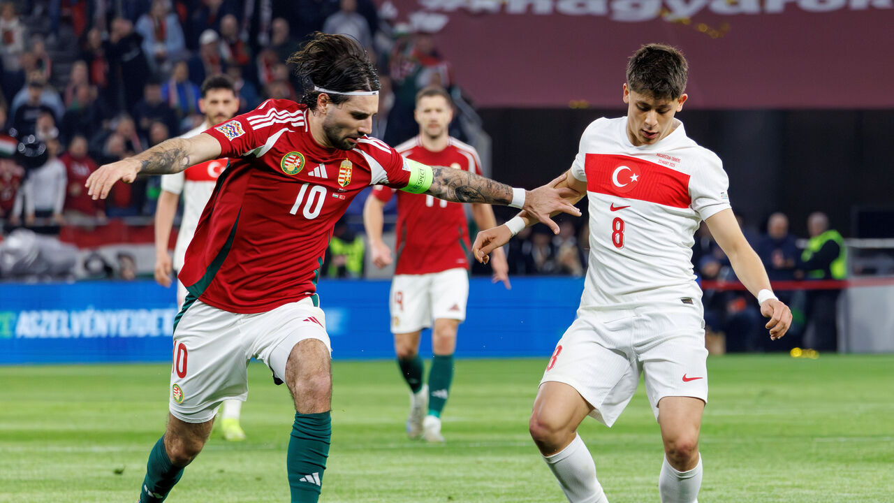 BUDAPEST, HUNGARY - MARCH 23: Dominik Szoboszlai of Hungary challenges Arda Guler of Türkiye during the UEFA Nations League 2024/25 League A/B Play-offs Second Leg match between Hungary and Türkiye at Puskas Arena on March 23, 2025 in Budapest, Hungary.