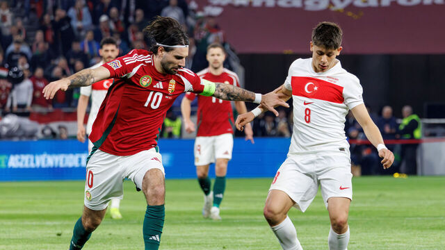 BUDAPEST, HUNGARY - MARCH 23: Dominik Szoboszlai of Hungary challenges Arda Guler of Türkiye during the UEFA Nations League 2024/25 League A/B Play-offs Second Leg match between Hungary and Türkiye at Puskas Arena on March 23, 2025 in Budapest, Hungary.