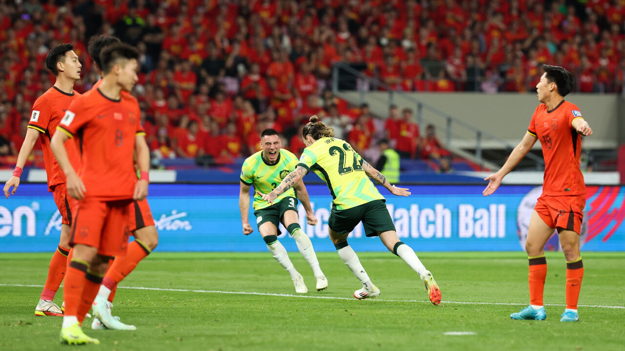 HANGZHOU, CHINA - MARCH 25: Jackson Irvine #22 of Australia celebrates his goal with teammates during the FIFA World Cup Asian Qualifiers Group C match between China and Australia at Hangzhou Olympic Sports Centre Stadium on March 25, 2025 in Hangzhou, China.