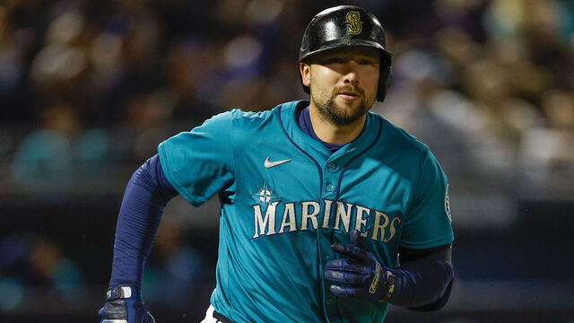 PEORIA, ARIZONA - MARCH 7: Cal Raleigh #29 of the Seattle Mariners runs to first base on a pop out in the third inning during a spring training game against the Los Angeles Dodgers at Peoria Stadium on March 7, 2025 in Peoria, Arizona.
