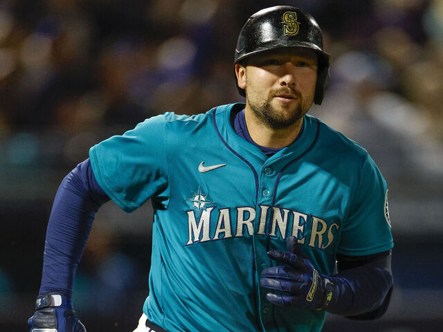 PEORIA, ARIZONA - MARCH 7: Cal Raleigh #29 of the Seattle Mariners runs to first base on a pop out in the third inning during a spring training game against the Los Angeles Dodgers at Peoria Stadium on March 7, 2025 in Peoria, Arizona.