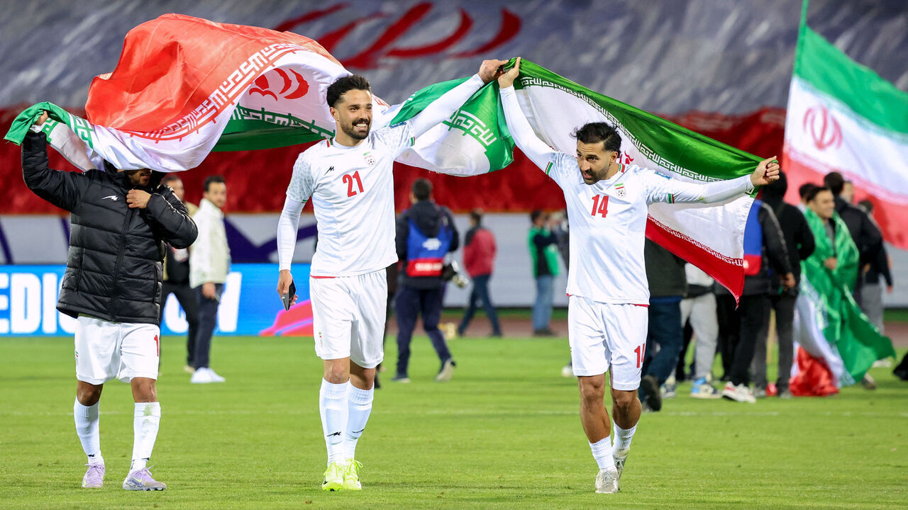 Iran's players celebrate after the FIFA World Cup 2026 Asia zone qualifiers group A football match between Iran and Uzbekistan, on March 25, 2025 in Tehran.