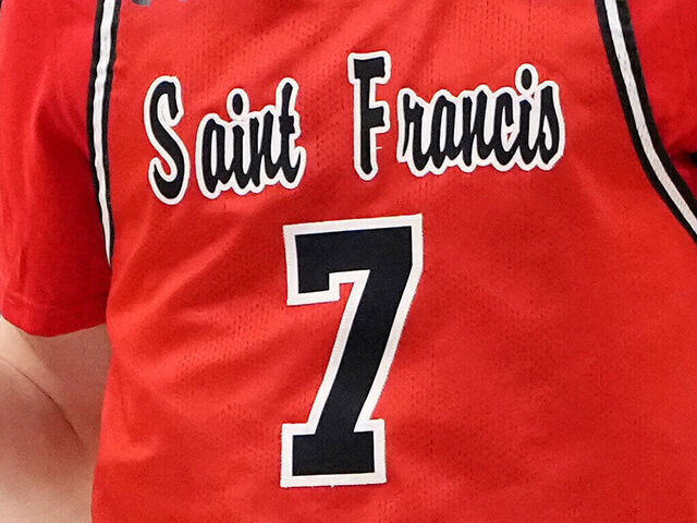 DAYTON, OHIO - MARCH 18: Jeremy Clayville #7 of the St. Francis (Pa) Red Flash celebrates a three point basket during the second half against the Alabama State Hornets in the First Four game of the NCAA Men's Basketball Tournament at University of Dayton Arena on March 18, 2025 in Dayton, Ohio.