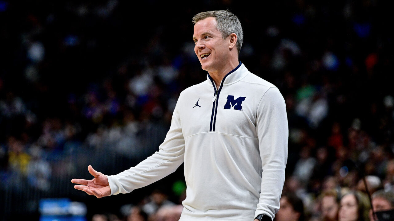 DENVER, COLORADO - MARCH 20: Head coach Dusty May of the Michigan Wolverines reacts in the first half of a game against the UC San Diego Tritons in the first round of the NCAA Men's Basketball Tournament at Ball Arena on March 20, 2025 in Denver, Colorado.