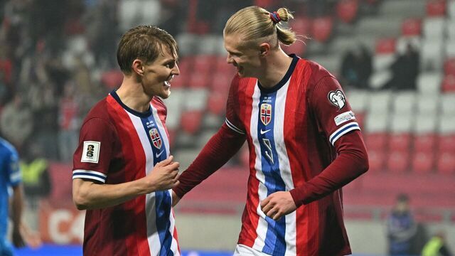 Norway's forward #09 Erling Braut Haland (R) celebrates with Norway's midfielder #10 Martin Odegaard scoring his side's fourth goal during the 2026 World Cup Group I qualifier football match between Israel and Norway, in Debrecen, Hungary, on March 25, 2025.