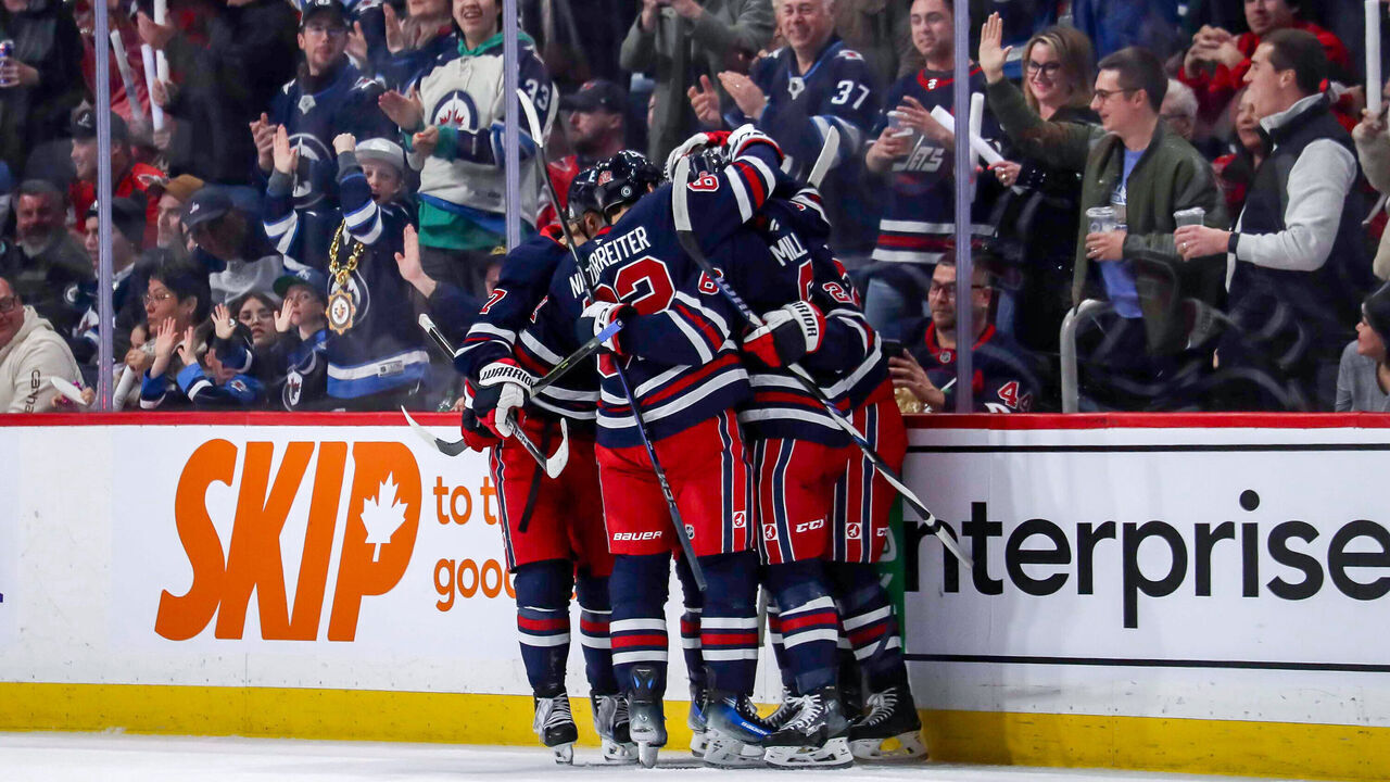 WINNIPEG, CANADA - MARCH 25: Vladislav Namestnikov #7, Nino Niederreiter #62, Colin Miller #6 and Mason Appleton #22 of the Winnipeg Jets celebrate a second period goal against the Washington Capitals at the Canada Life Centre on March 25, 2025 in Winnipeg, Manitoba, Canada.