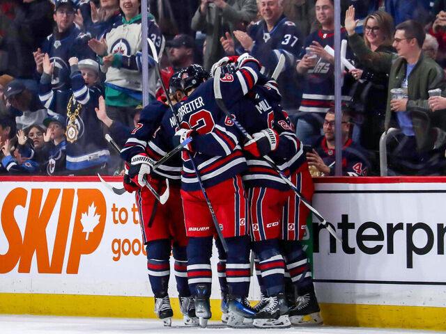 WINNIPEG, CANADA - MARCH 25: Vladislav Namestnikov #7, Nino Niederreiter #62, Colin Miller #6 and Mason Appleton #22 of the Winnipeg Jets celebrate a second period goal against the Washington Capitals at the Canada Life Centre on March 25, 2025 in Winnipeg, Manitoba, Canada.