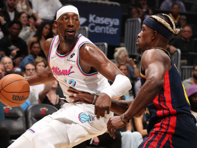 MIAMI, FL - MARCH 25: Bam Adebayo #13 of the Miami Heat handles the ball during the game against the Golden State Warriors on March 25, 2025 at Kaseya Center in Miami, Florida. Mandatory Copyright Notice: Copyright 2025 NBAE