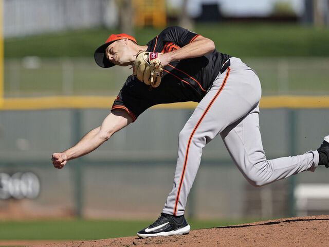 SCOTTSDALE, ARIZONA - FEBRUARY 19: Tyler Rogers #71 of the San Francisco Giants pitches during live baseball practice at Scottsdale Stadium on February 19, 2025 in Scottsdale, Arizona.