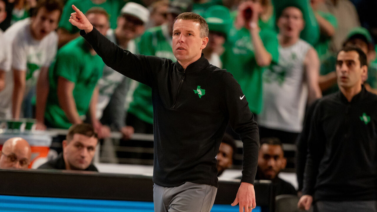 FORT WORTH, TX - MARCH 15: North Texas Mean Green head coach Ross Hodge points as he walks the sideline during the American Athletic Conference Championship tournament game between the North Texas Mean Green and Florida Atlantic Owls on March 15, 2024 at Dickies Arena in Fort Worth, Texas.