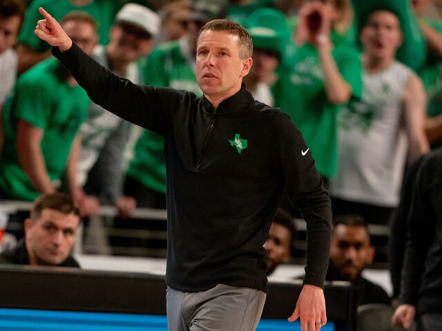 FORT WORTH, TX - MARCH 15: North Texas Mean Green head coach Ross Hodge points as he walks the sideline during the American Athletic Conference Championship tournament game between the North Texas Mean Green and Florida Atlantic Owls on March 15, 2024 at Dickies Arena in Fort Worth, Texas.