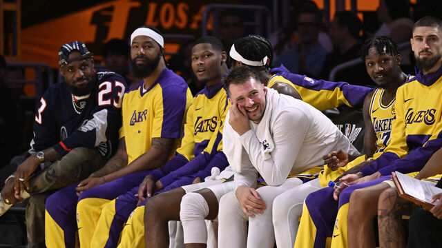 Los Angeles, CA - March 19: LeBron James, left, reacts on the bench along teammates including Luka Doncic, center, of the Los Angeles Lakers in the second half of a NBA basketball game against the Denver Nuggets at Crypto.com Arena in Los Angeles on Wednesday, March 19, 2025.