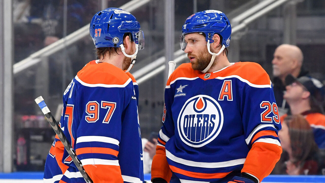 EDMONTON, CANADA - FEBRUARY 1: Leon Draisaitl #29 and Connor McDavid #97 have a conversation during a stoppage in play during the game against the Toronto Maple Leafs at Rogers Place on February 1, 2025, in Edmonton, Alberta, Canada.