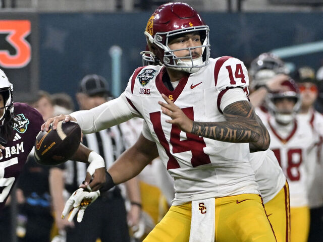 LAS VEGAS, NEVADA - DECEMBER 27: Jayden Maiava #14 of the USC Trojans looks to pass against the Texas A&M Aggies during second half of the SRS Distribution Las Vegas Bowl at Allegiant Stadium on December 27, 2024 in Las Vegas, Nevada. The Trojans defeated the Aggies 35-31.
