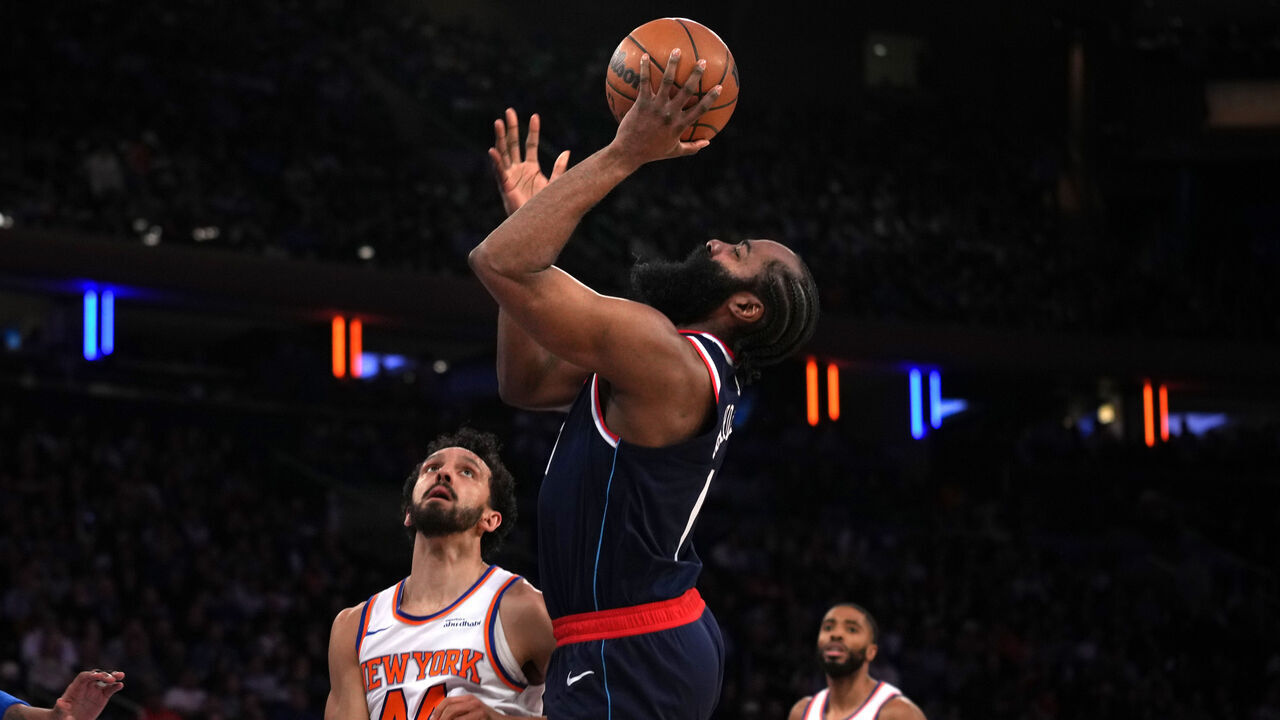NEW YORK, NEW YORK - MARCH 26: James Harden #1 of the Los Angeles Clippers goes up for a shot against Landry Shamet #44 and Karl-Anthony Towns #32 of the New York Knicks in the second quarter at Madison Square Garden on March 26, 2025 in New York City.