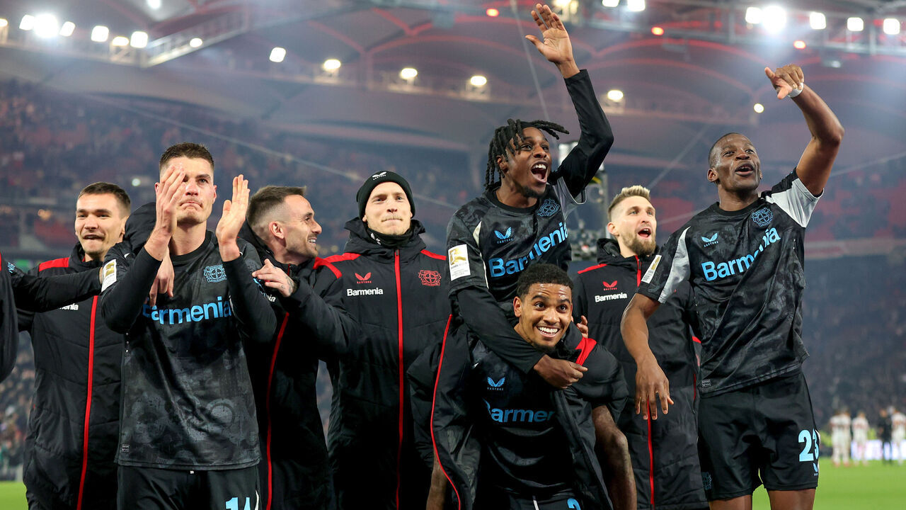 STUTTGART, GERMANY - MARCH 16: Jeremie Frimpong (top) and teammates celebrate the victory after the Bundesliga match between VfB Stuttgart and Bayer 04 Leverkusen at MHPArena on March 16, 2025 in Stuttgart, Germany.