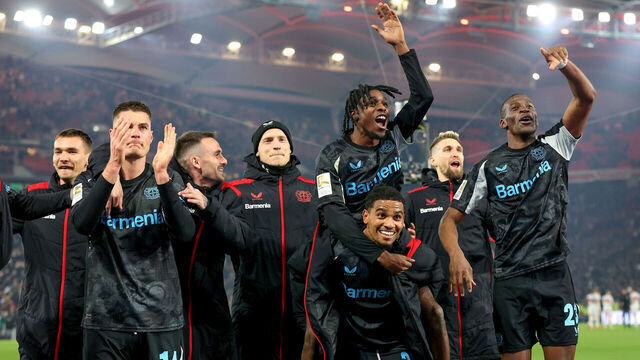 STUTTGART, GERMANY - MARCH 16: Jeremie Frimpong (top) and teammates celebrate the victory after the Bundesliga match between VfB Stuttgart and Bayer 04 Leverkusen at MHPArena on March 16, 2025 in Stuttgart, Germany.