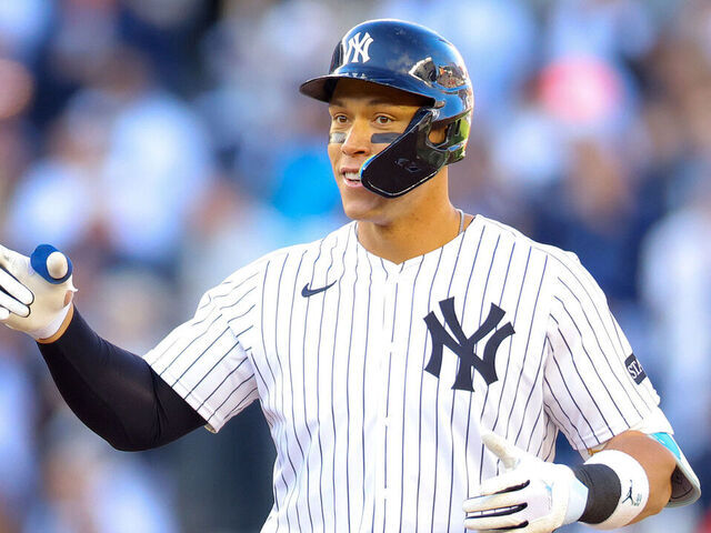 NEW YORK, NEW YORK - MARCH 27: Aaron Judge #99 of the New York Yankees reacts after hitting a an RBI double in the seventh inning against the Milwaukee Brewers on Opening Day at Yankee Stadium on March 27, 2025 in New York City.