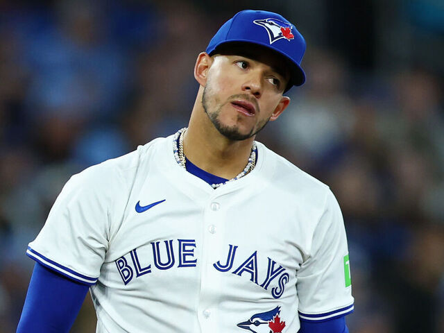 TORONTO, ONTARIO - MARCH 27: José Berríos #17 of the Toronto Blue Jays reacts against the Baltimore Orioles during the first inning on Opening Day at Rogers Centre on March 27, 2025 in Toronto, Ontario.