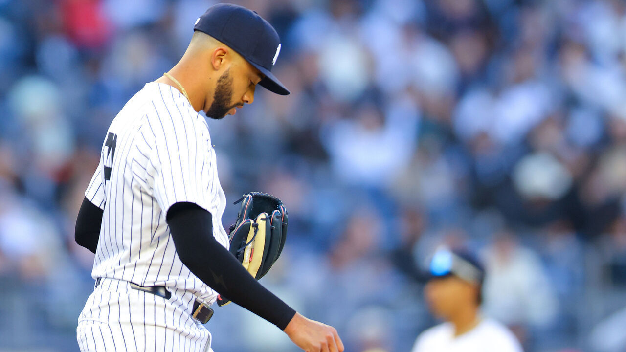 NEW YORK, NEW YORK - MARCH 27: Devin Williams #38 of the New York Yankees reacts after a walk in the ninth inning against the Milwaukee Brewers on Opening Day at Yankee Stadium on March 27, 2025 in New York City.