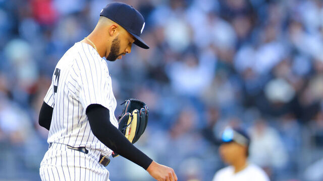 NEW YORK, NEW YORK - MARCH 27: Devin Williams #38 of the New York Yankees reacts after a walk in the ninth inning against the Milwaukee Brewers on Opening Day at Yankee Stadium on March 27, 2025 in New York City.