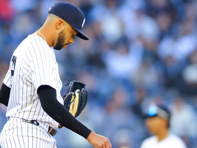 NEW YORK, NEW YORK - MARCH 27: Devin Williams #38 of the New York Yankees reacts after a walk in the ninth inning against the Milwaukee Brewers on Opening Day at Yankee Stadium on March 27, 2025 in New York City.