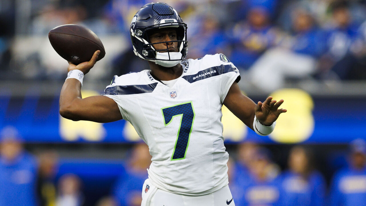 INGLEWOOD, CALIFORNIA - JANUARY 5: Geno Smith #7 of the Seattle Seahawks throws on the run during the fist half against the Los Angeles Rams at SoFi Stadium on January 5, 2025 in Inglewood, California.