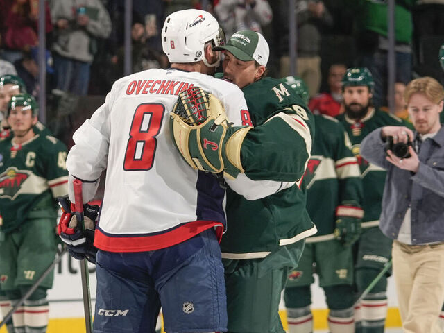 SAINT PAUL, MN - MARCH 27: Marc-Andre Fleury #29 of the Minnesota Wild and Alex Ovechkin #8 of the Washington Capitals share a moment following the game at the Xcel Energy Center on March 27, 2025 in Saint Paul, Minnesota.