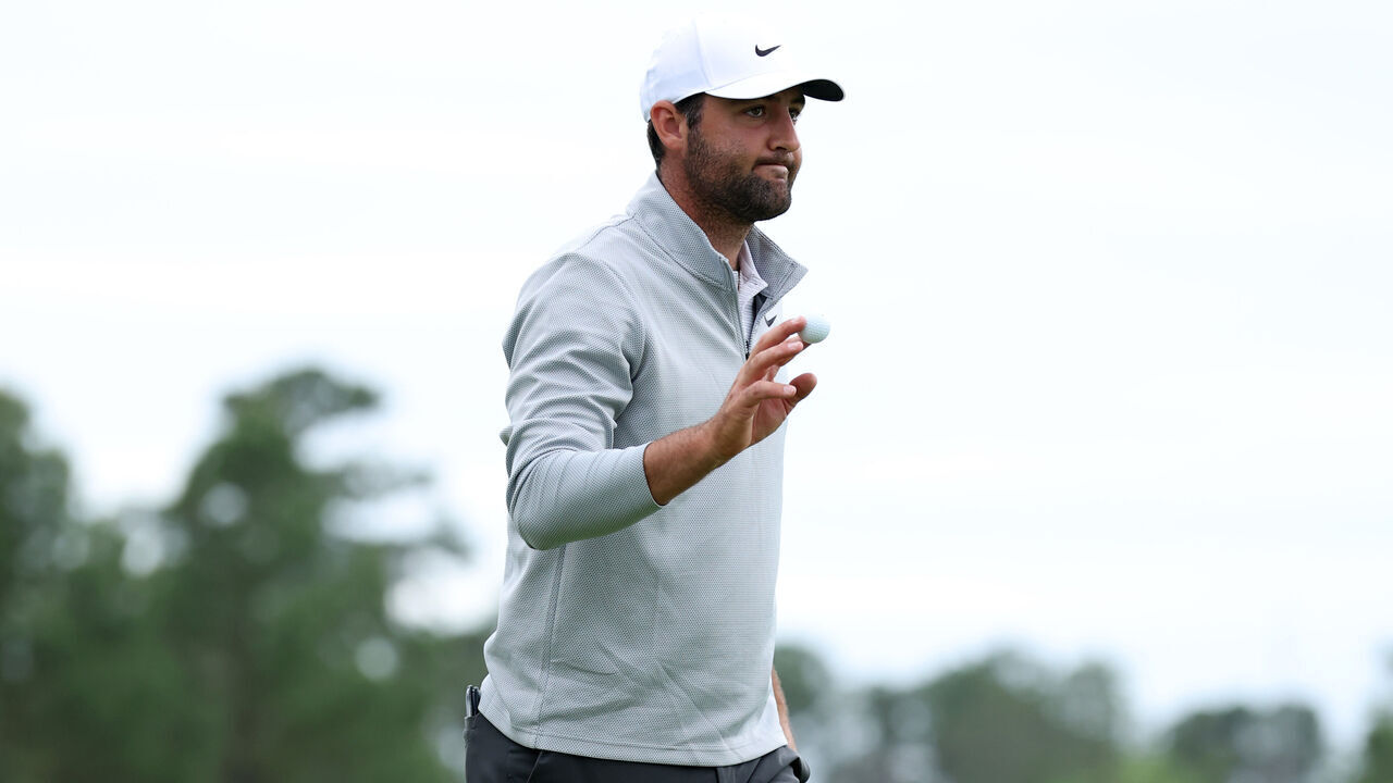 HOUSTON, TEXAS - MARCH 28: Scottie Scheffler of the United States waves to crowd after scoring a par to complete his second round of the Texas Children's Houston Open 2025 on the ninth green at Memorial Park Golf Course on March 28, 2025 in Houston, Texas.