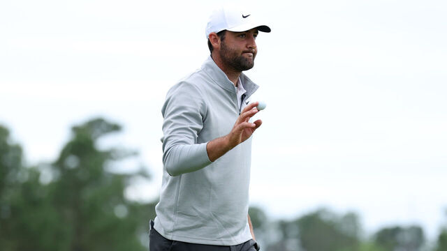 HOUSTON, TEXAS - MARCH 28: Scottie Scheffler of the United States waves to crowd after scoring a par to complete his second round of the Texas Children's Houston Open 2025 on the ninth green at Memorial Park Golf Course on March 28, 2025 in Houston, Texas.