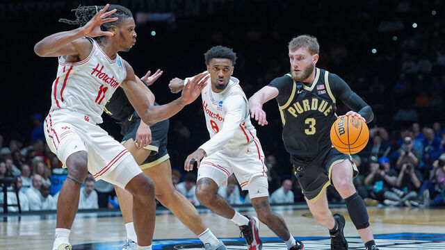INDIANAPOLIS, INDIANA - MARCH 28: Braden Smith #3 of the Purdue Boilermakers dribbles against Joseph Tugler #11 of the Houston Cougars during the first half in the Sweet Sixteen round of the 2025 NCAA Men's Basketball Tournament held at Lucas Oil Stadium on March 28, 2025 in Indianapolis, Indiana.