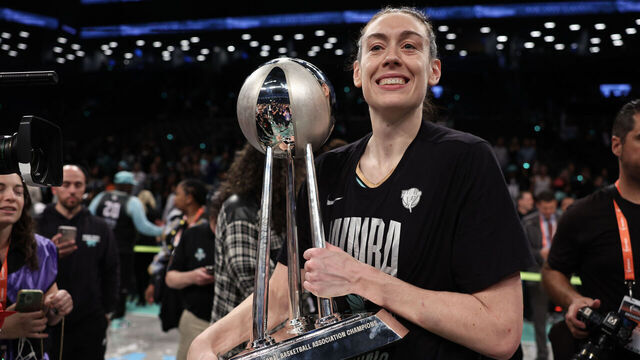 NEW YORK, NEW YORK - OCTOBER 20: Breanna Stewart #30 of the New York Liberty celebrates with the WNBA Championship Trophy after winning Game Five of the WNBA Finals at Barclays Center on October 20, 2024 in New York City.