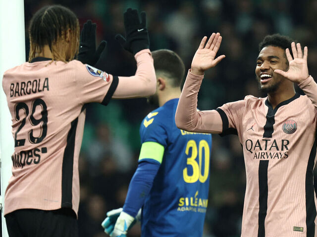 Paris Saint-Germain's French forward #49 Ibrahim Mbaye (R) celebrates scoring his team's sixth goal during the French L1 football match between AS Saint-Etienne and Paris Saint-Germain (PSG) at the Geoffroy-Guichard stadium in Saint-Etienne, central France on March 29, 2025.