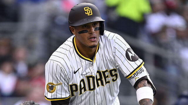 SAN DIEGO, CALIFORNIA - MARCH 29: Manny Machado #13 of the San Diego Padres is checked by a trainer during the fourth inning against the Atlanta Braves at Petco Park on March 29, 2025 in San Diego, California.