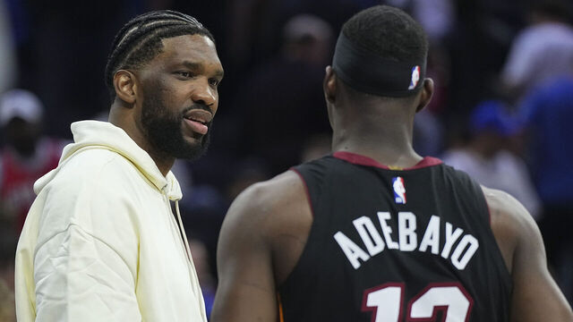 PHILADELPHIA, PENNSYLVANIA - MARCH 29: Joel Embiid #21 of the Philadelphia 76ers talks to Bam Adebayo #13 of the Miami Heat after the game at the Wells Fargo Center on March 29, 2025 in Philadelphia, Pennsylvania. The Heat defeated the 76ers 118-95. NOTE TO USER: User expressly acknowledges and agrees that, by downloading and/or using this photograph, user is consenting to the terms and conditions of the Getty Images License Agreement.
