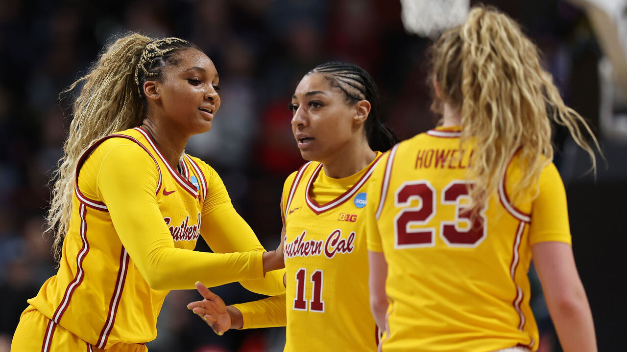 SPOKANE, WASHINGTON - MARCH 29: Kiki Iriafen #44, Kennedy Smith #11, and Avery Howell #23 of the USC Trojans celebrate in the third quarter against the Kansas State Wildcats in the Sweet Sixteen round of the NCAA Women's Basketball Tournament at Spokane Arena on March 29, 2025 in Spokane, Washington.