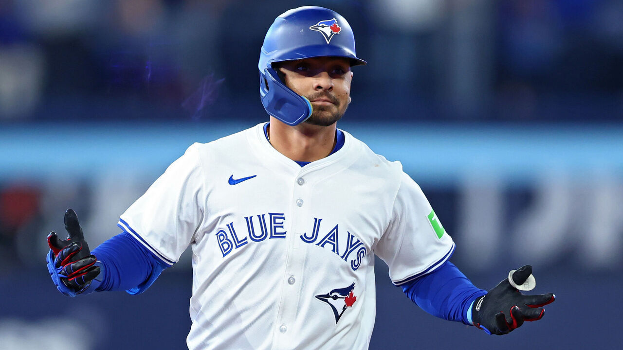TORONTO, ONTARIO - MARCH 27: Andrés Giménez #0 of the Toronto Blue Jays jogs around the bases after hitting a two-run home run against the Baltimore Orioles during the fourth inning on Opening Day at Rogers Centre on March 27, 2025 in Toronto, Ontario.