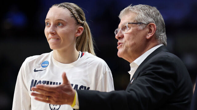 SPOKANE, WASHINGTON - MARCH 29: Paige Bueckers #5 of the Connecticut Huskies meets with head coach Geno Auriemma at halftime against the Oklahoma Sooners in the Sweet Sixteen round of the NCAA Women's Basketball Tournament at Spokane Arena on March 29, 2025 in Spokane, Washington.