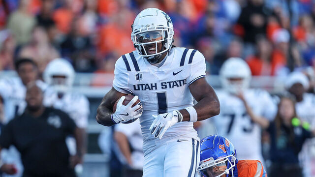 BOISE, ID - OCTOBER 5: Wide receiver Jalen Royals #1 of the Utah State Aggies catches a long touchdown pass during the first half against the Utah State Aggies at Albertsons Stadium on October 5, 2024 in Boise, Idaho.