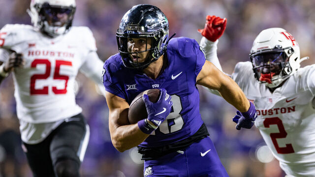 FORT WORTH, TX - OCTOBER 04: TCU Horned Frogs wide receiver Jack Bech (#18) breaks away from Houston Cougars cornerback Latrelll McCutchin Sr. (#1) and safety A.J. Haulcy (#2) for a touchdown during the Big 12 college football game between the Houston Cougars and TCU Horned Frogs on October 4, 2024 at Amon G. Carter Stadium in Fort Worth, TX.